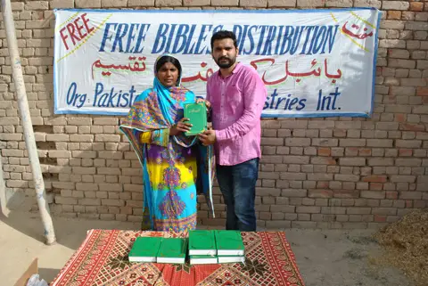 Holy Bible distribution & village fellowship