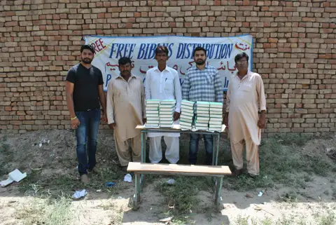 Holy Bible distribution & village fellowship