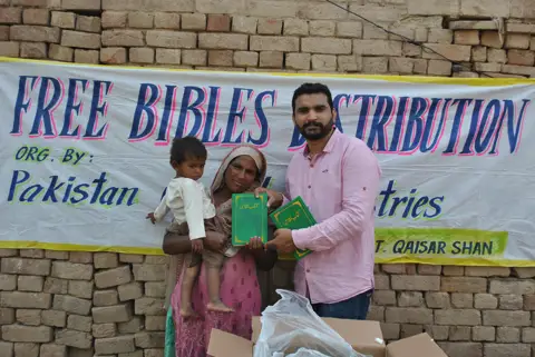 Holy Bible distribution & village fellowship